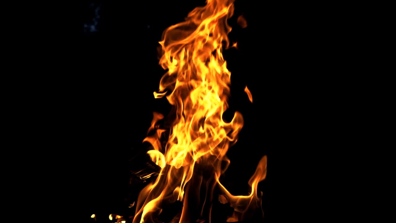 Bonfire. The fire is lit in the night. Slow motion