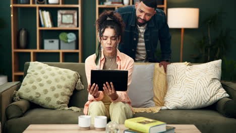 couple using a tablet at home