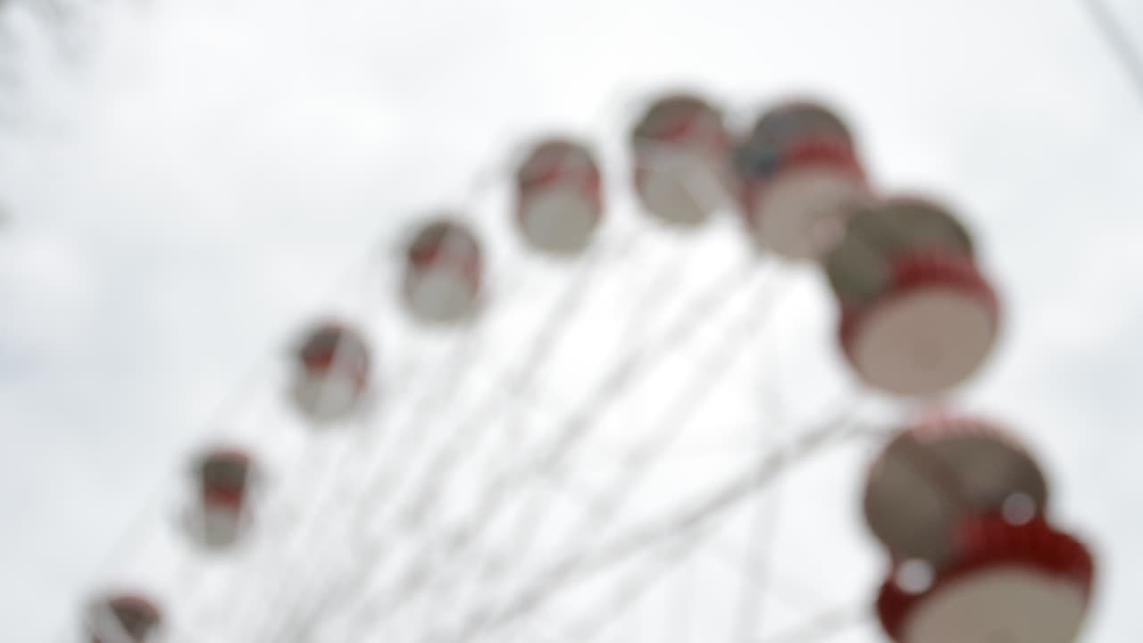 Brightly colored Ferris wheel against the blue sky