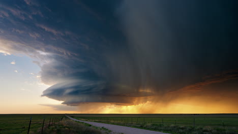 dramatic supercell thunderstorm over vast plains at sunset