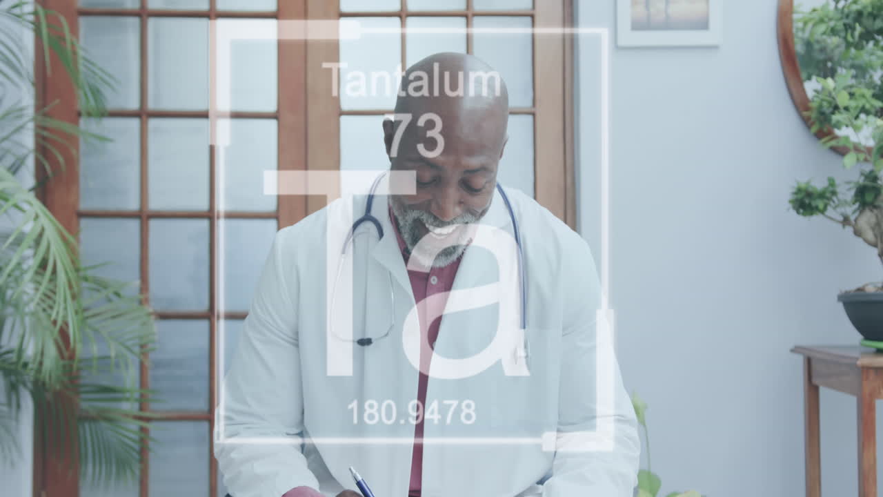 Animation of elements symbols over african american male doctor having video call