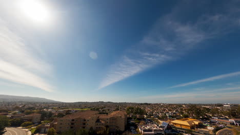 the bright yellow sun moving across the sky over torrance, california - time lapse