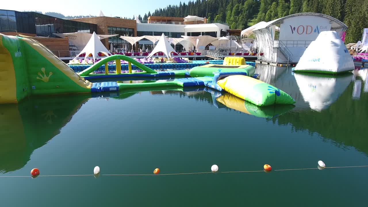 Bukovel, Ukraine - August 2017: Luxury hotel in the mountains. Recreation complex with a swimming pool. Aerial view