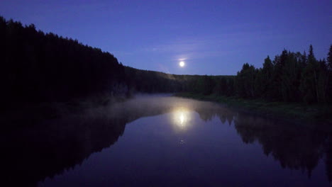 moonlit river reflections in a misty forest