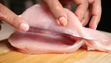 preparing raw chicken breast