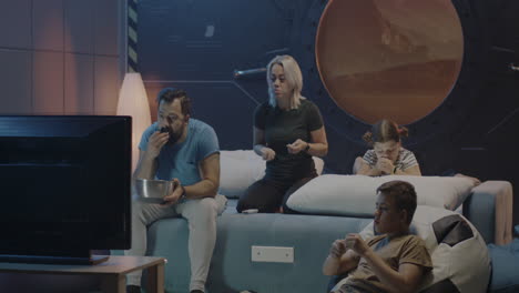 family watching a sci-fi movie at home