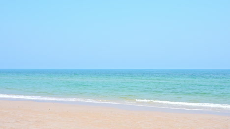 Light-caribbean-sea-waves-breaking-on-empty-white-sandy-beach,-tropical-serenity-on-hot-summer-day,-full-frame
