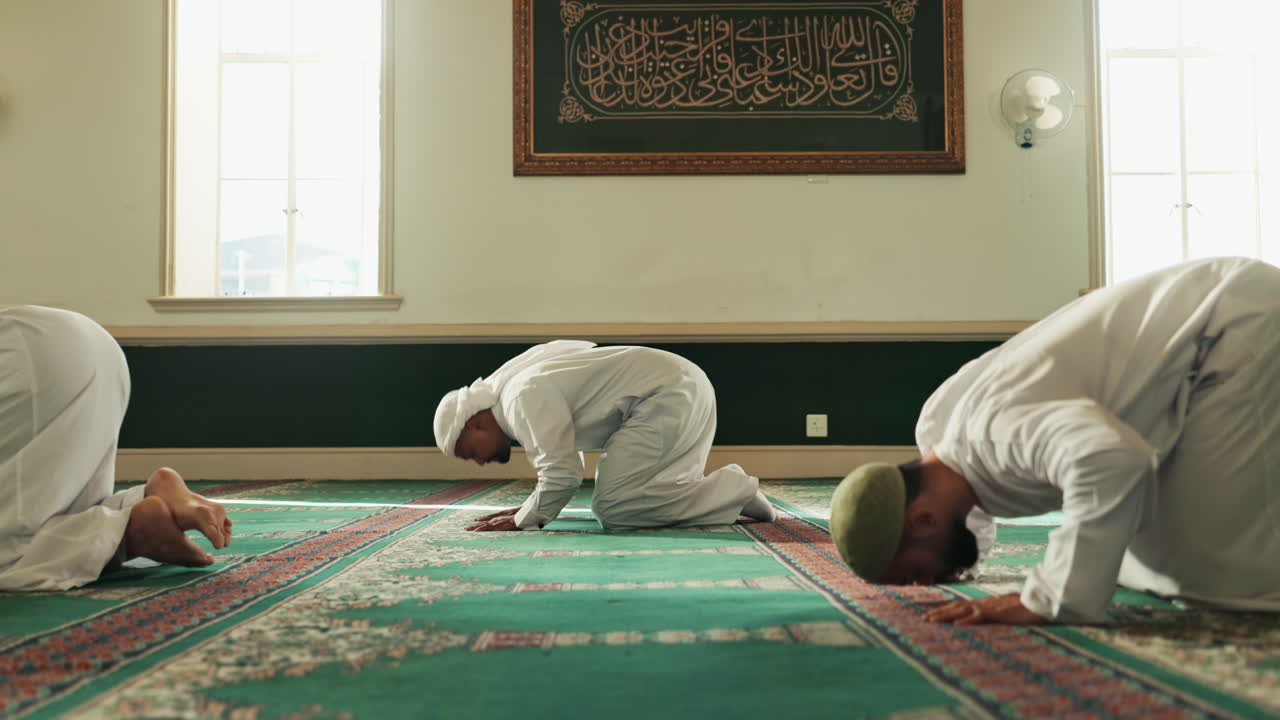 Muslim men praying in a mosque