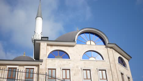 mosque with blue windows and minaret