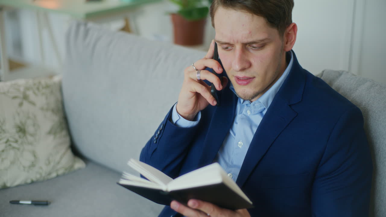 Businessman Multitasks During Call