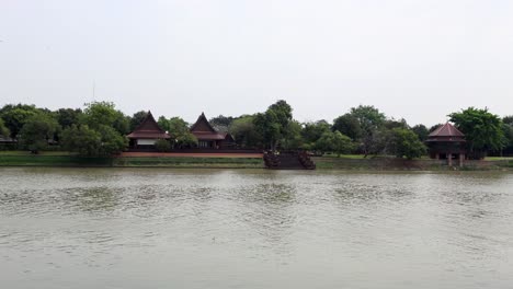 scenic view of ancient house by the river