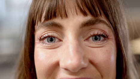 close-up of woman's eyes and face, focusing on expression and detail