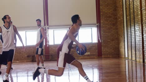 Basketball-players-playing-in-the-court