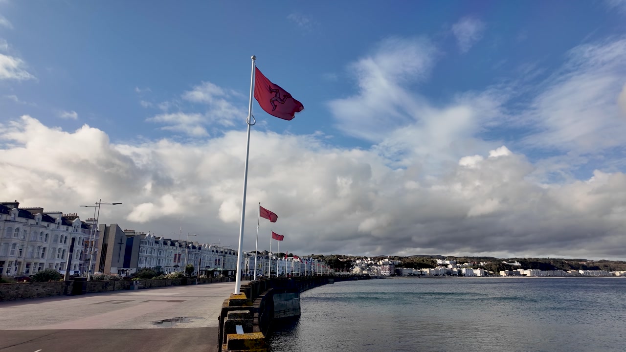 Flags flying along the promenade and bay in Douglas, Isle of Man