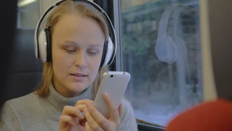 Woman-Listening-to-Music-and-Writing-Messages