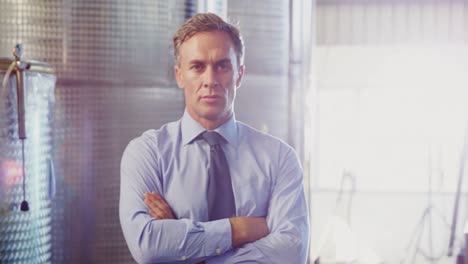 Portrait-of-manager-standing-with-arms-crossed-4k