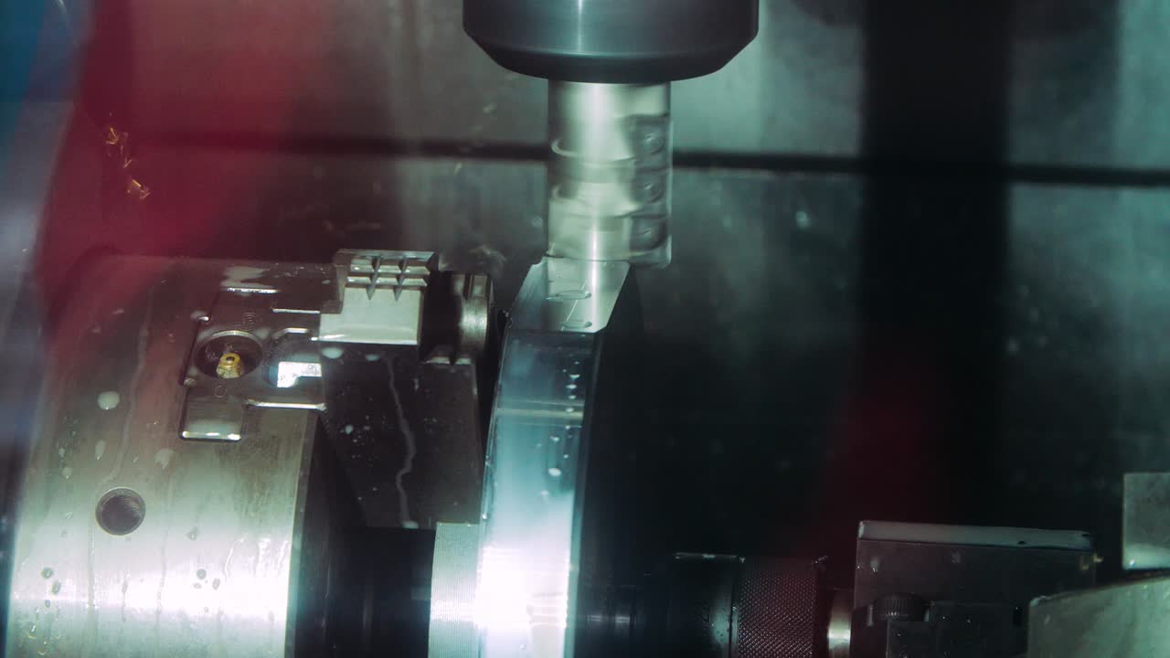 Industrial cutter removing metal layer during metalworking. Milling machine