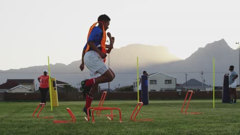 Young-adult-female-rugby-team-training