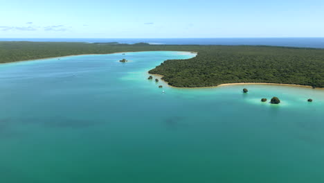 Wide-aerial-establishing-view-of-iconic-Upi-Bay,-Isle-of-Pines,-New-Caledonia