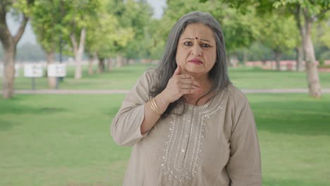 Indian-old-woman-getting-shocked-by-watching-something-in-park