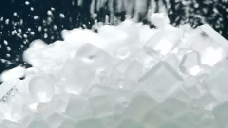 a close-up view of glimmering ice crystals captured in motion, showcasing their unique geometric shapes and reflective qualities in a dramatic light setting