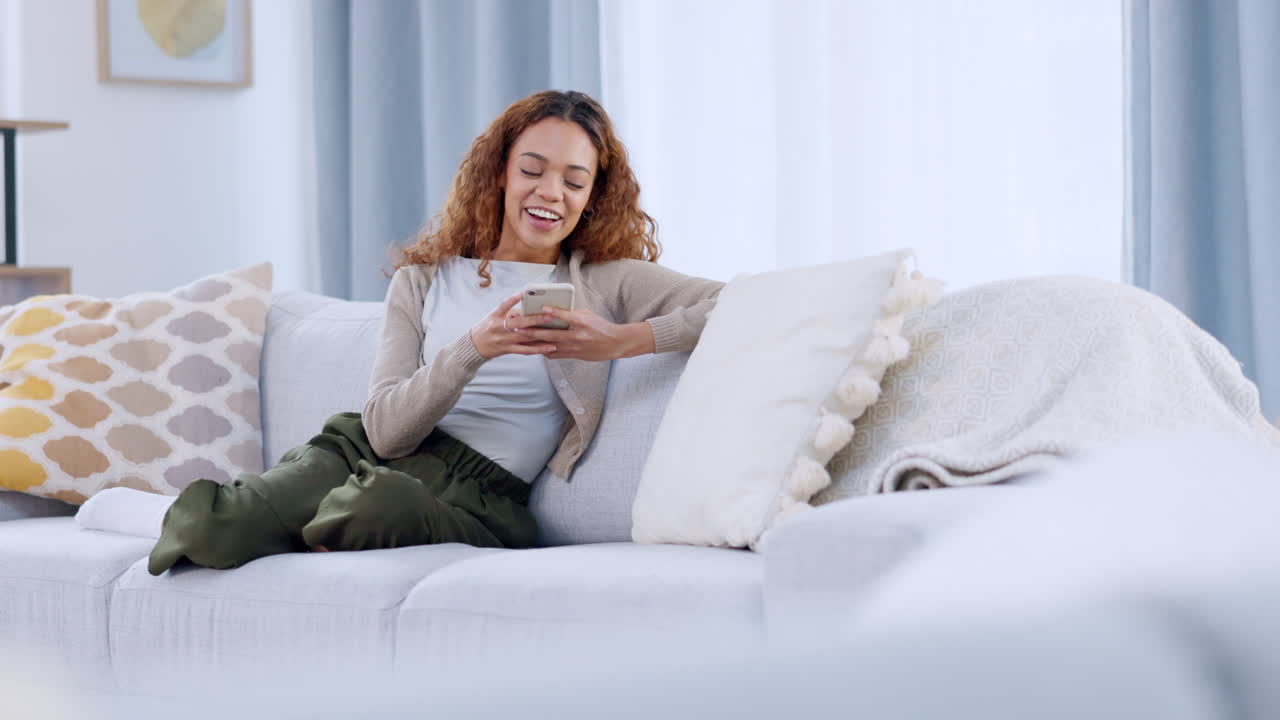 A relaxed woman reading and replying to a funny