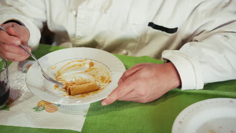 person eating pasta