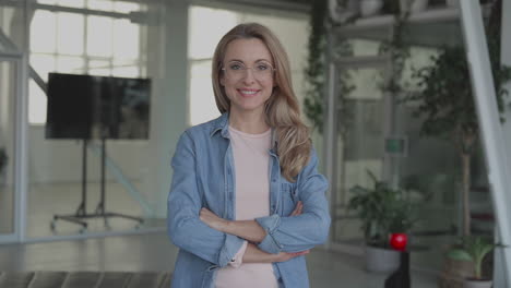 Business-mature-female-looking-at-camera-smiling.-Portrait.-International-Women's-Day.