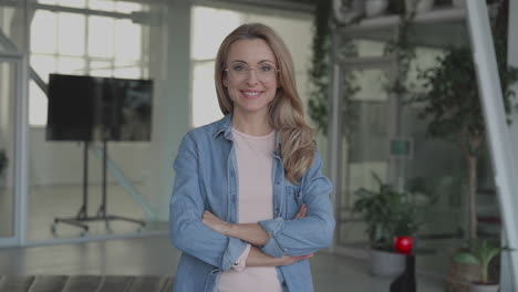Business mature female looking at camera smiling. Portrait. International Women&#039;s Day.