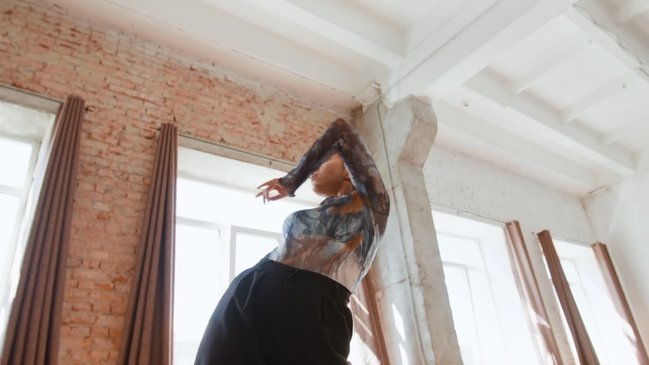 Woman Dancing Contemporary Movement in a Bright Studio Loft