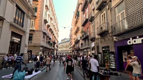 people walking in a bustling alleyway