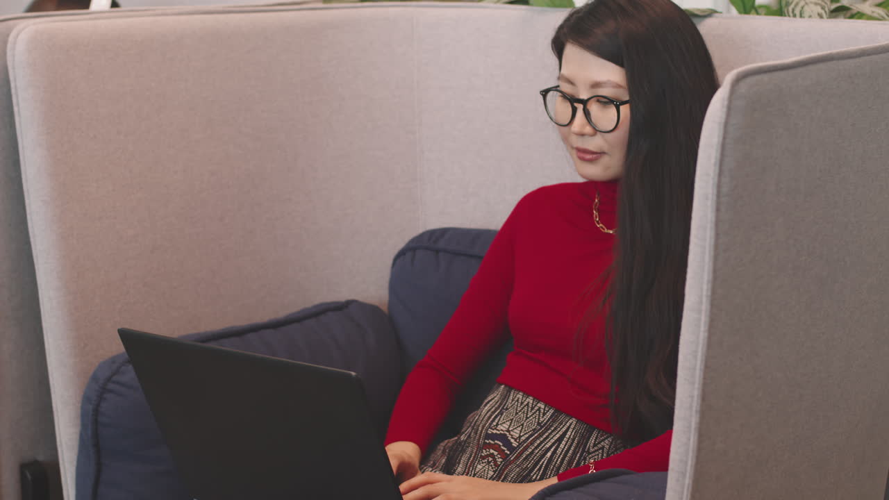 Young Asian Businesswoman Working in Coworking Space