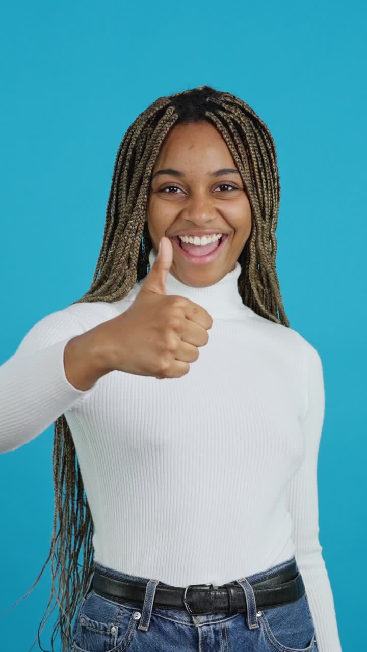 Smiling African American Woman Giving Thumbs Up