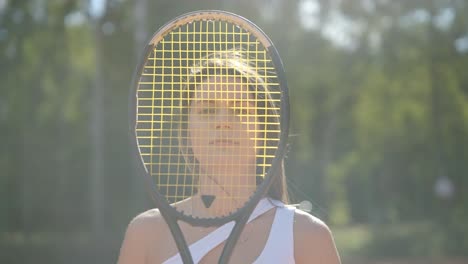 a young woman practicing tennis on an outdoor court with a coach. the coach provides guidance as the player works on her technique, perfecting her strokes in an athletic training session.