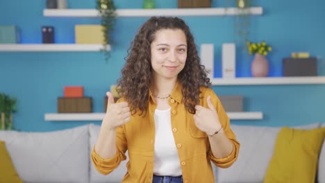 Young-woman-looking-at-camera-making-confidence-sign.