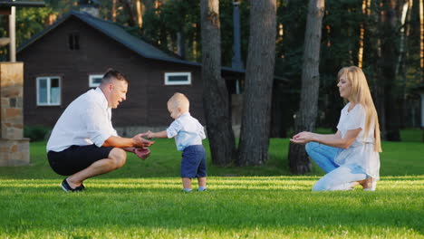 Happy-Young-Family-Playing-With-Their-1-Year-Old-Son-In-The-Yard-Slow-Motion-Video