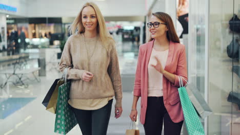 two women shopping in a mall
