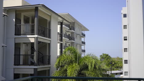 panning over white modern apartment complex in residential area