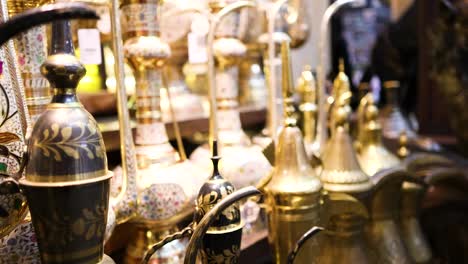 display of ornate brass vases and souvenirs