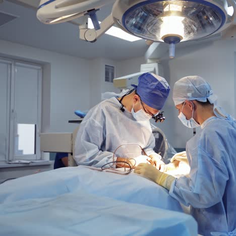 team surgeon at work in operating room. modern equipment in operating room. medical devices for neurosurgery