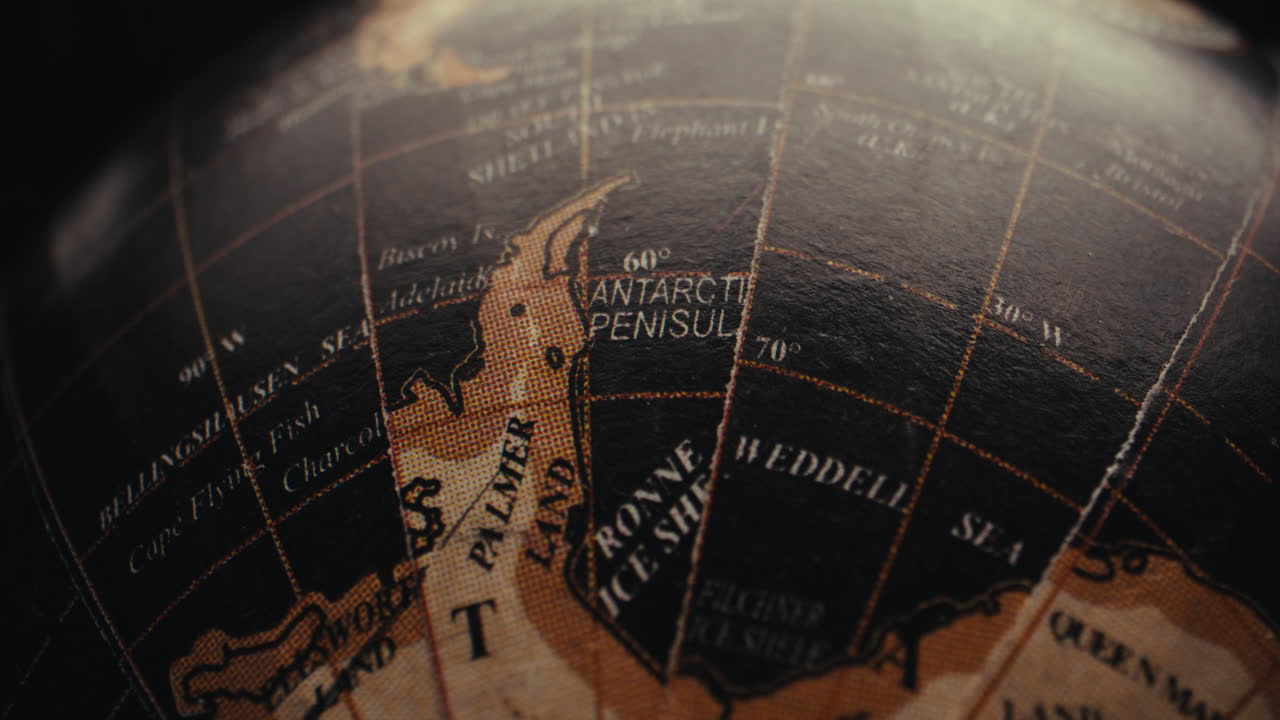 Close-up of a Vintage World Globe Focusing on Antarctica
