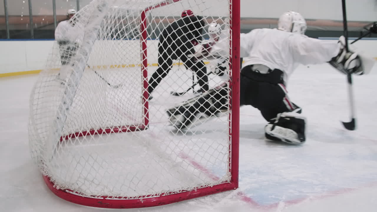 Scoring Goal Into Net During Hockey Game