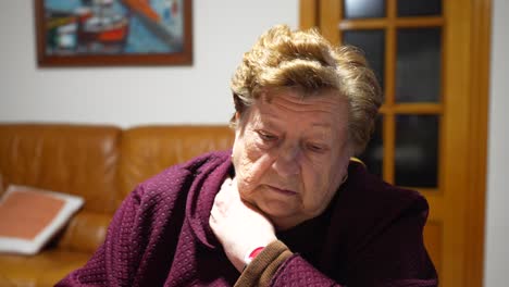 worried old widow woman thinking about her last days of life at home