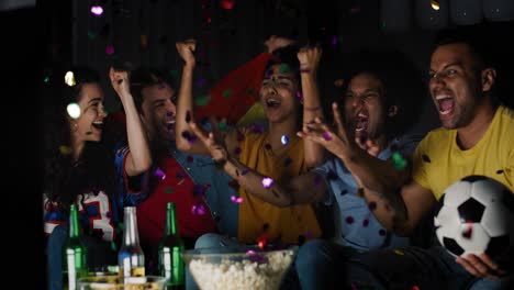 handheld video of fans celebrating victory at night.