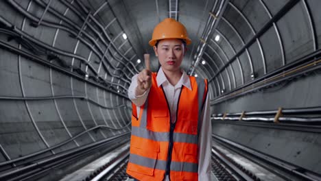 Woman Engineer Giving Stop Signal in Tunnel