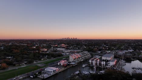 lakefront view of the city of new orleans skyline at sunset