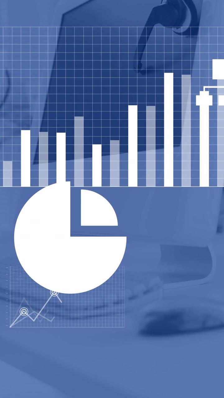 Animation af finansiel databehandling over en computer på et skrivebord på et kontor.