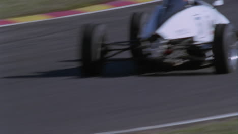 a formula car drives on a circuit track 4