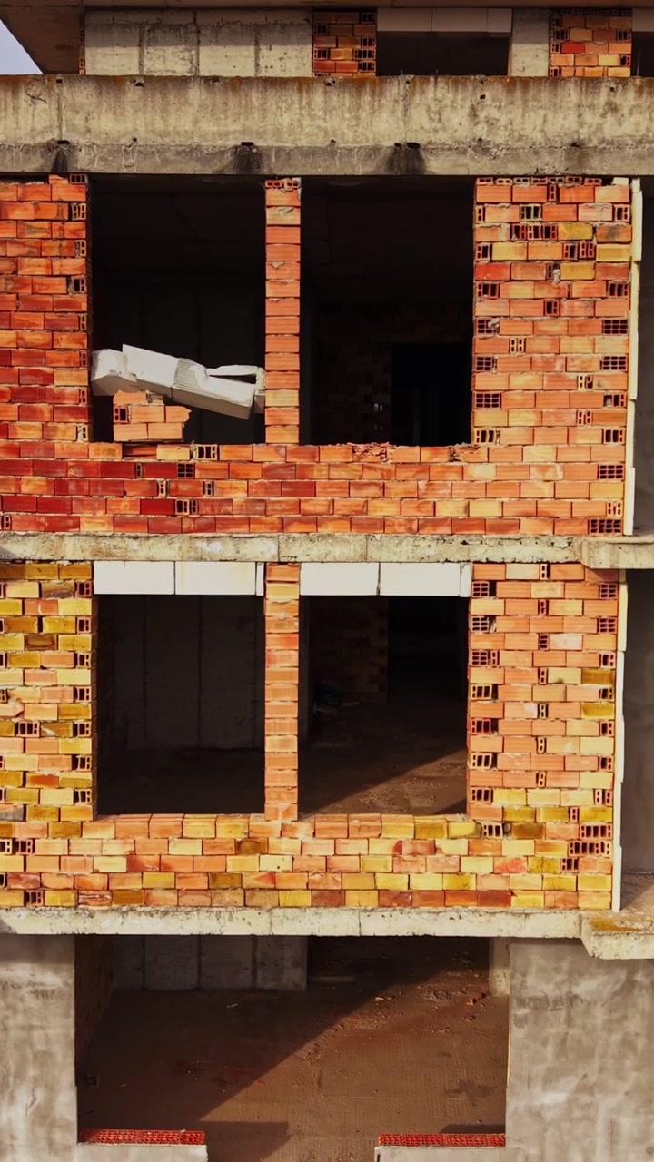 View of an abandoned building under construction in a rural area