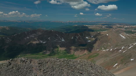 Aerial-cinematic-drone-early-morning-Grays-and-Torreys-14er-Peaks-flight-above-Rocky-Mountains-Continental-Divide-Colorado-stunning-landscape-view-mid-summer-beautiful-snow-on-top-forward-movement